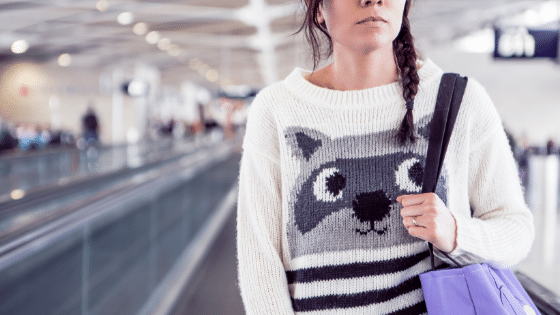 woman walking with purple bag